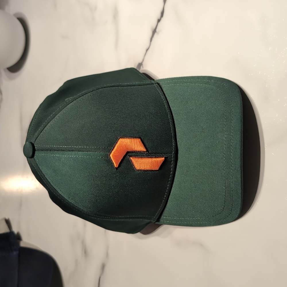 Peak Performance Green Cap with Orange Logo